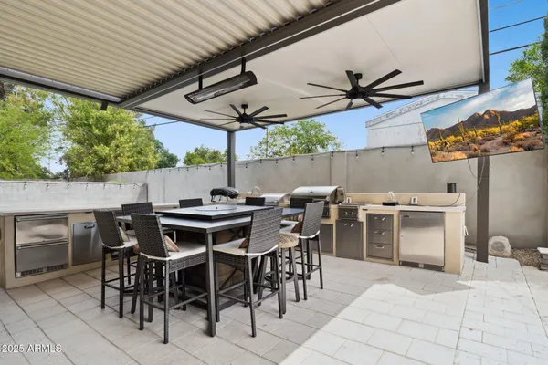 a view of a dinning table and chairs in the patio