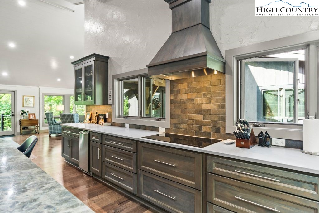 1325 Golf Course Road Linville, NC 28646 - Photo 17 of 46 a large kitchen with a large window and stainless steel appliances