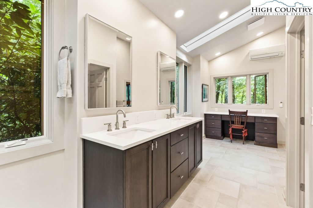 1325 Golf Course Road Linville, NC 28646 - Photo 28 of 46 a en suite bathroom with a double vanity sink and a mirror