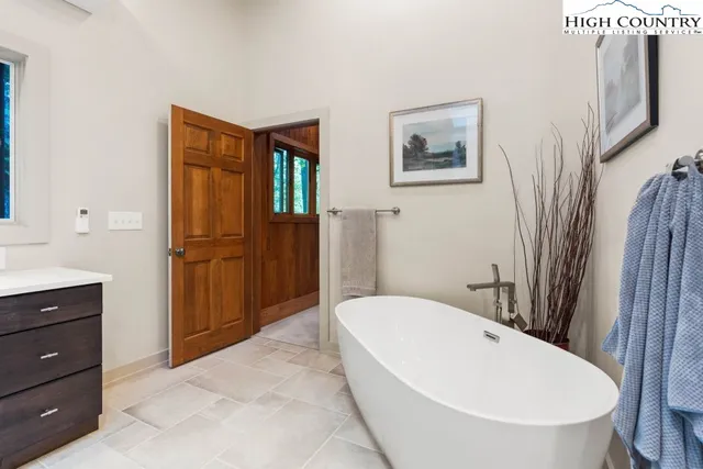 a bathroom with a bathtub and a sink