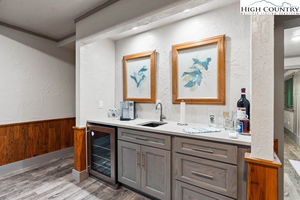 1325 Golf Course Road Linville, NC 28646 - Photo 40 of 46 a bathroom with a double vanity sink and a mirror