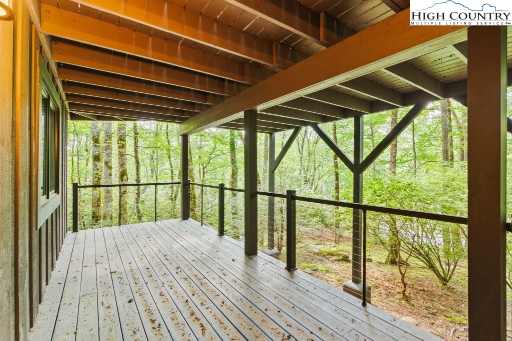 1325 Golf Course Road Linville, NC 28646 - Photo 44 of 46 a balcony with wooden floor and outdoor space