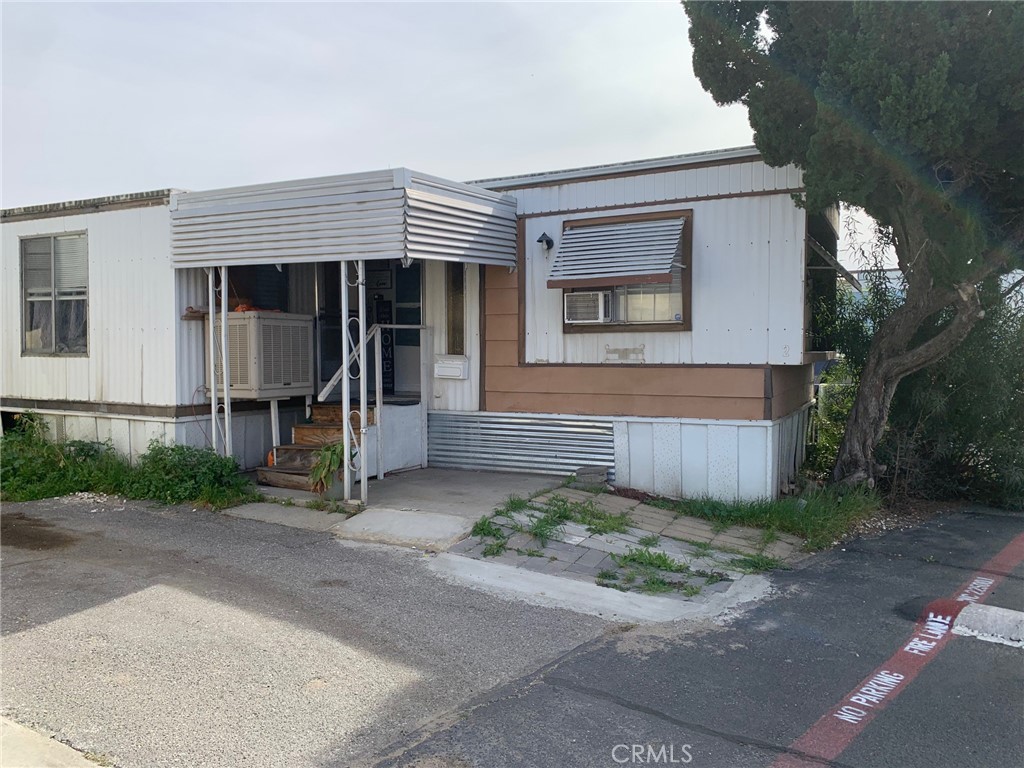 2865 West Rialto Avenue, Unit 2 Rialto, CA 92376 - Photo 1 of 19 front view of a house with a small yard