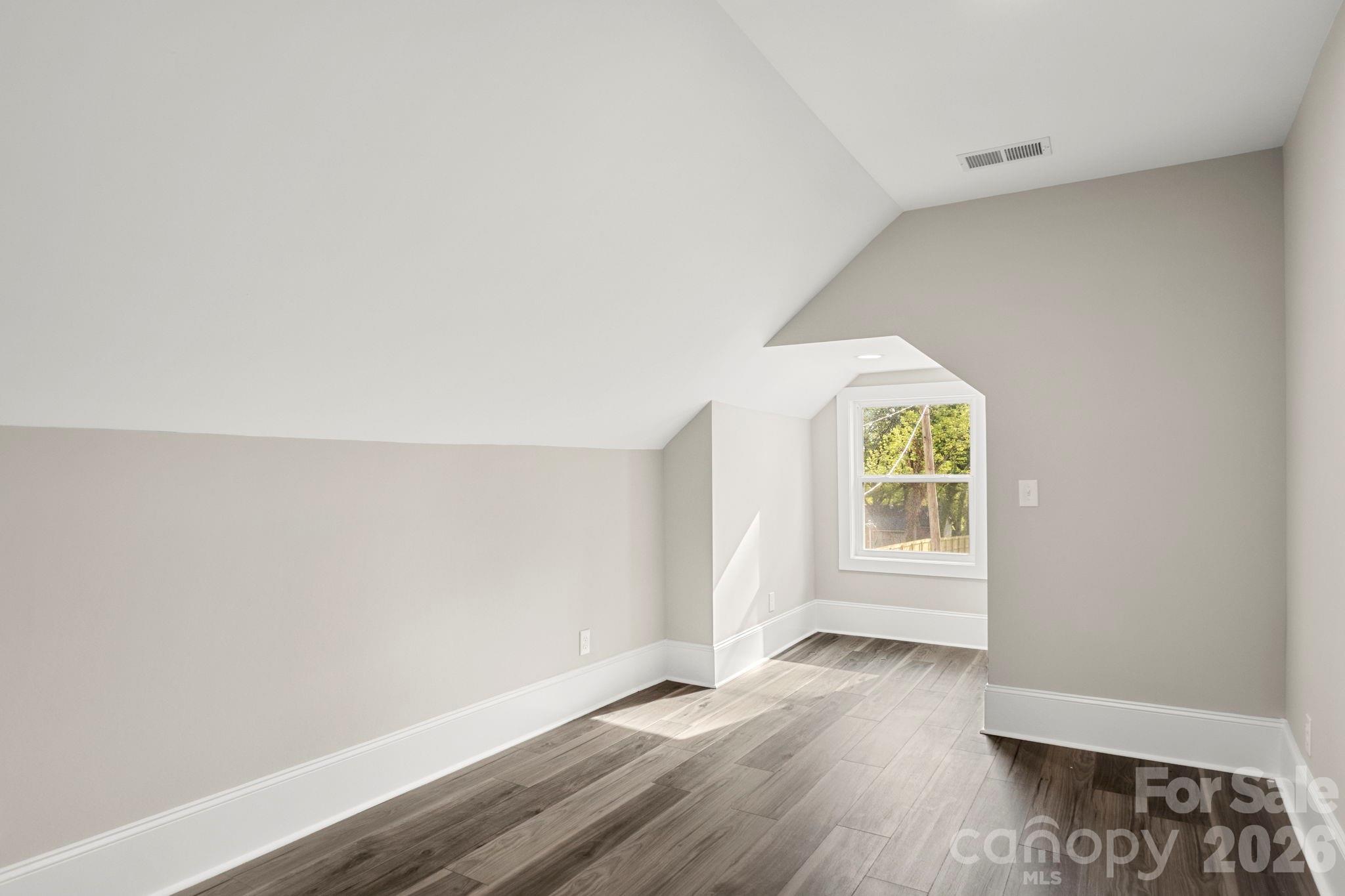 918 North New Hope Road Gastonia, NC 28054 - Photo 31 of 37 an empty room with wooden floor and window