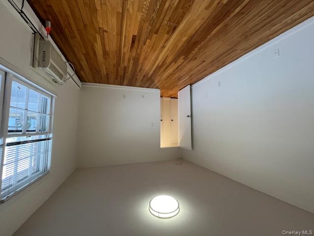 84 Shore Road, Unit D2 Port Washington, NY 11050 - Photo 11 of 12 a view of an empty room with wooden floor and a window