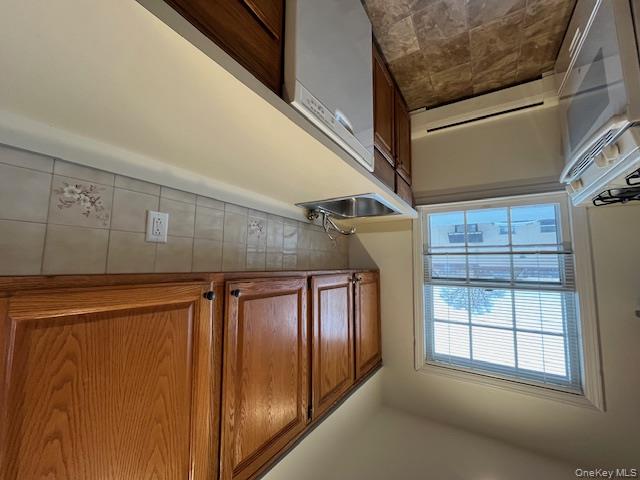 84 Shore Road, Unit D2 Port Washington, NY 11050 - Photo 7 of 12 a room with storage and utility