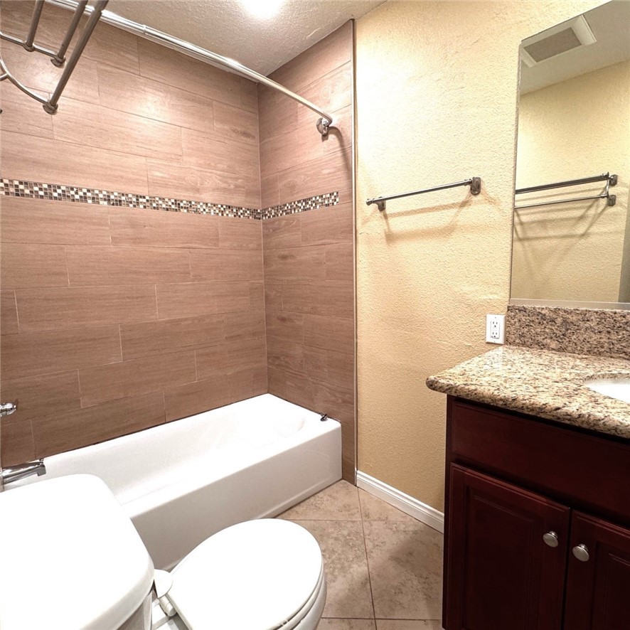 520 West Rte 66, Unit 5 Glendora, CA 91740 - Photo 4 of 5 a bathroom with a granite countertop sink toilet and shower