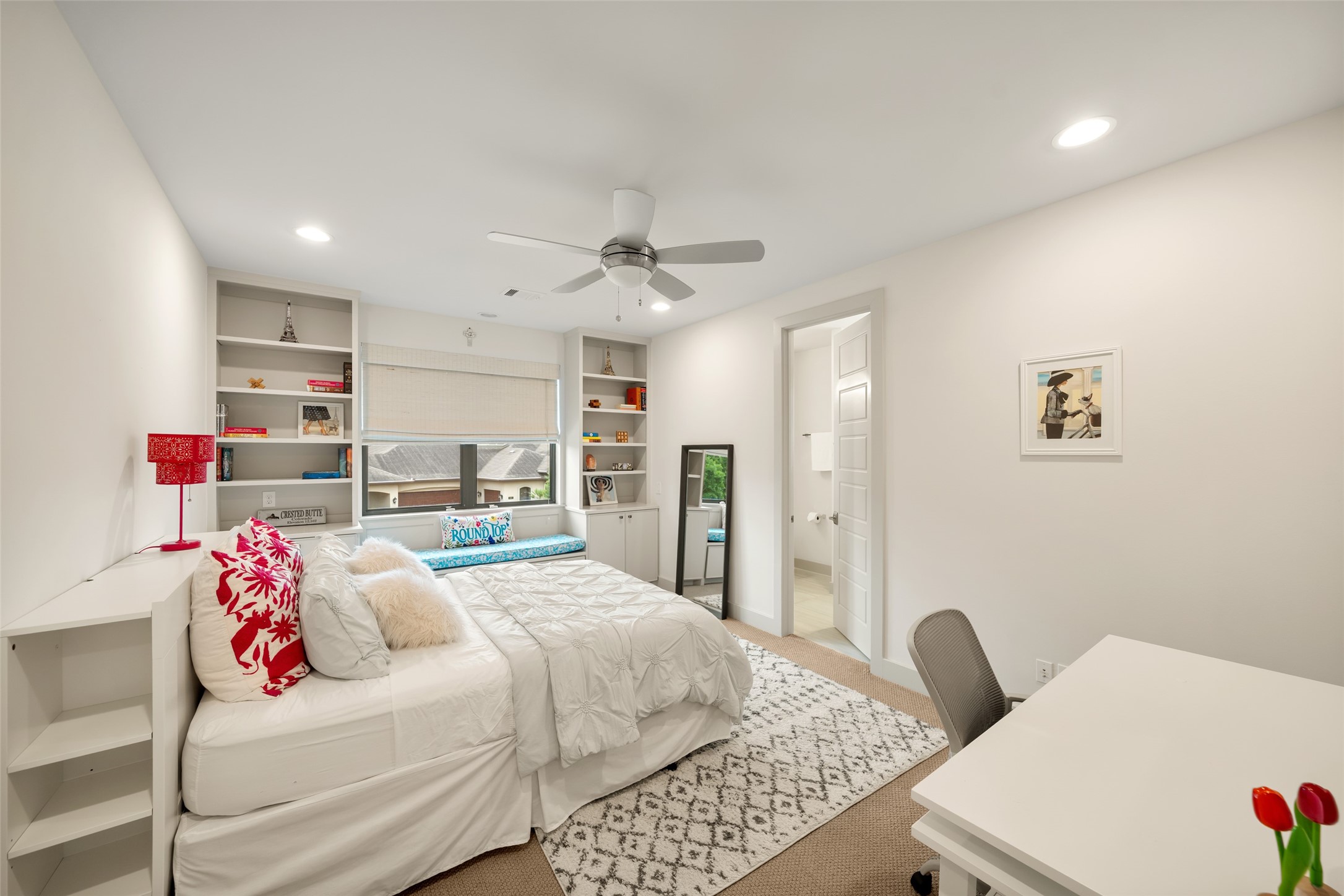 24902 Delaney Knoll Spring, TX 77389 - Photo 29 of 49 a bedroom with a bed and a chandelier
