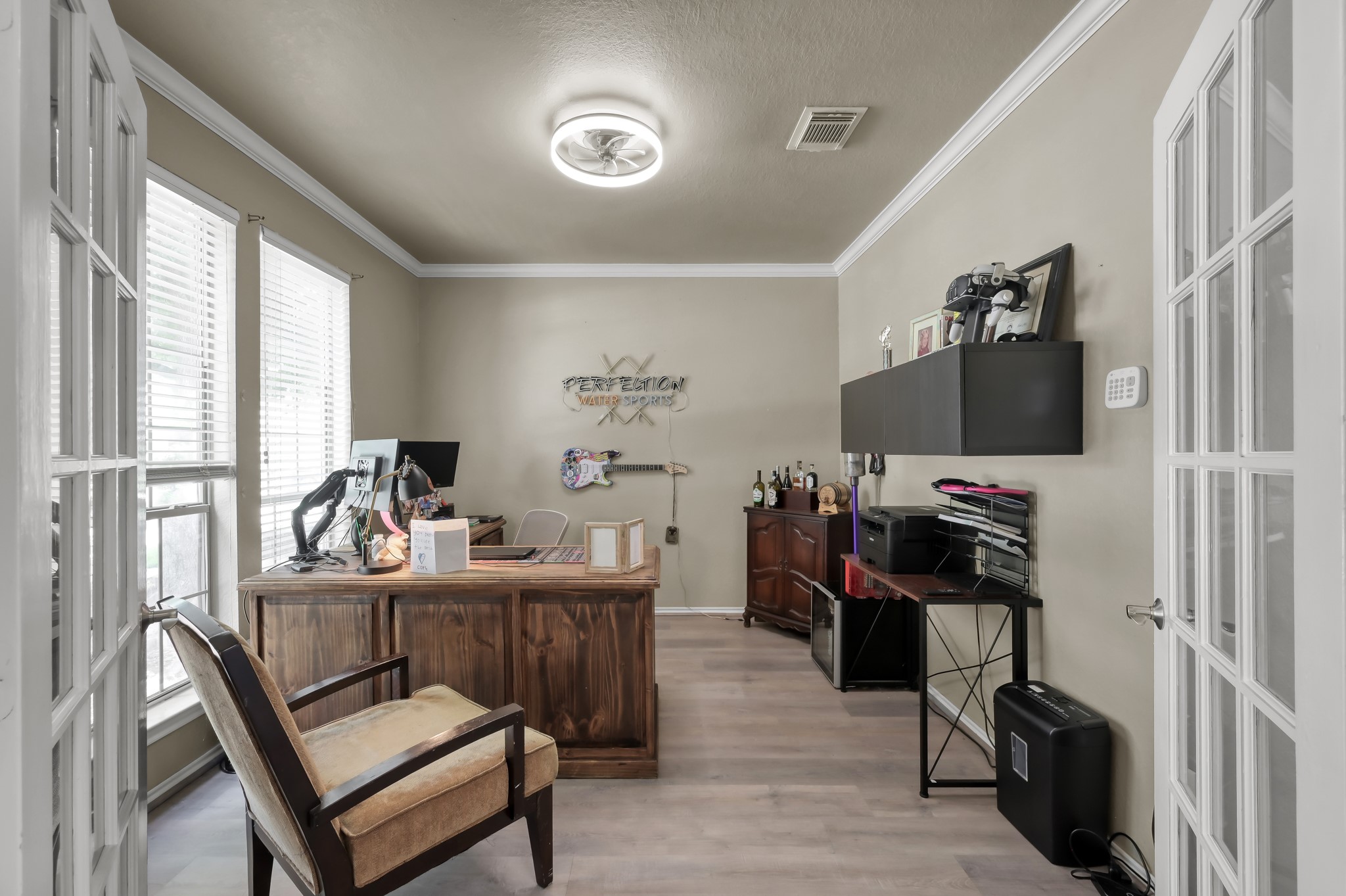 28522 Misty Cliff Lane Spring, TX 77386 - Photo 3 of 12 Private home office with French doors, large windows, and plenty of natural light. Ideal flex space for working from home, studying, or creating a quiet retreat.