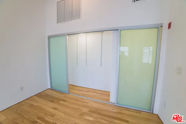 a view of a big room with wooden floor