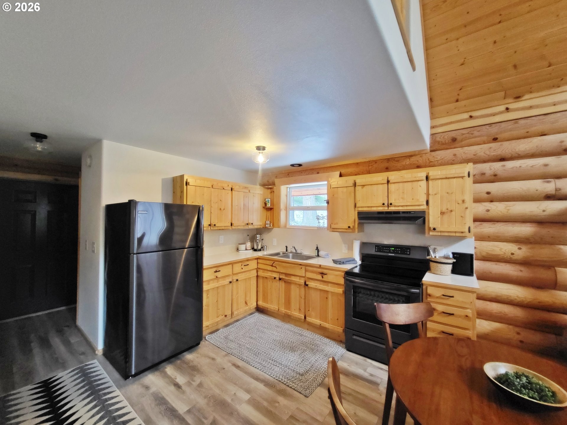 84730 Talmena Road Wallowa Lake, OR 97846 - Photo 19 of 25 a kitchen with stainless steel appliances granite countertop a refrigerator and a stove top oven