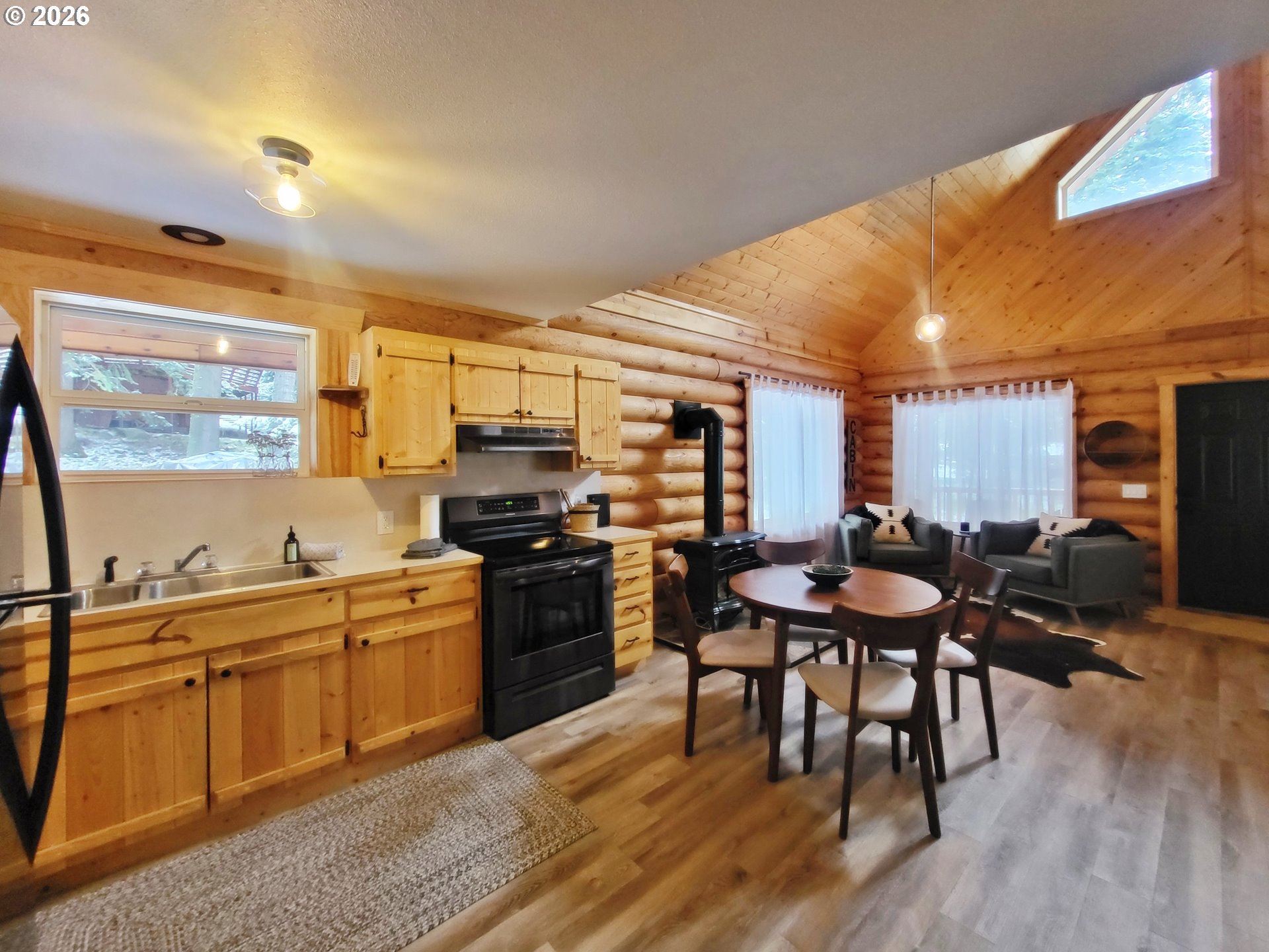 84730 Talmena Road Wallowa Lake, OR 97846 - Photo 20 of 25 a kitchen with stainless steel appliances kitchen island granite countertop a sink and cabinets