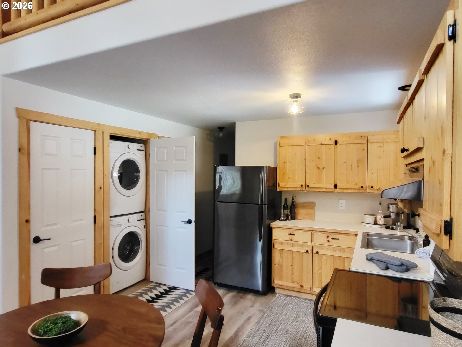 84730 Talmena Road Wallowa Lake, OR 97846 - Photo 21 of 25 a kitchen with a refrigerator sink and stove