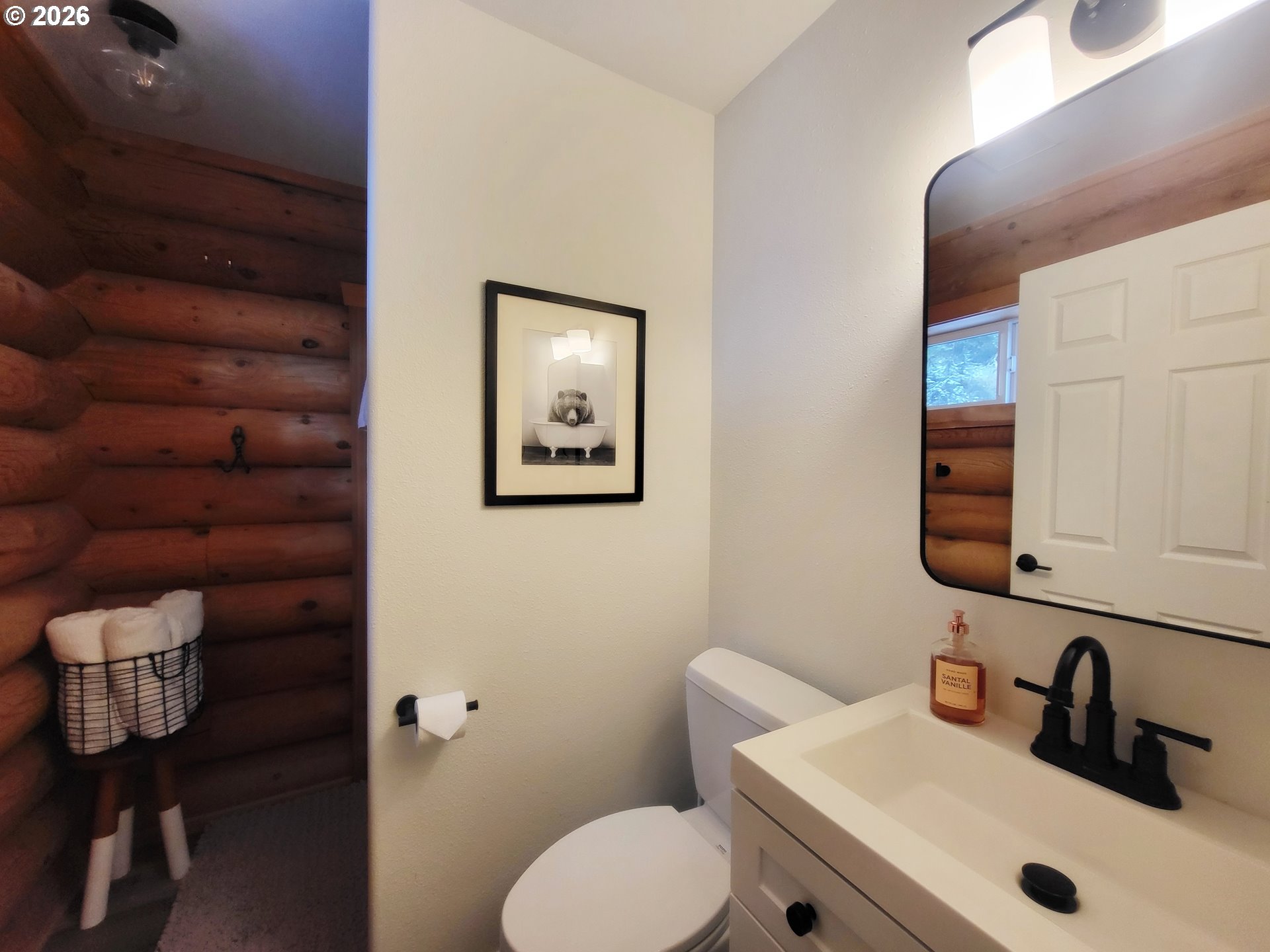84730 Talmena Road Wallowa Lake, OR 97846 - Photo 23 of 25 a bathroom with a toilet sink and mirror