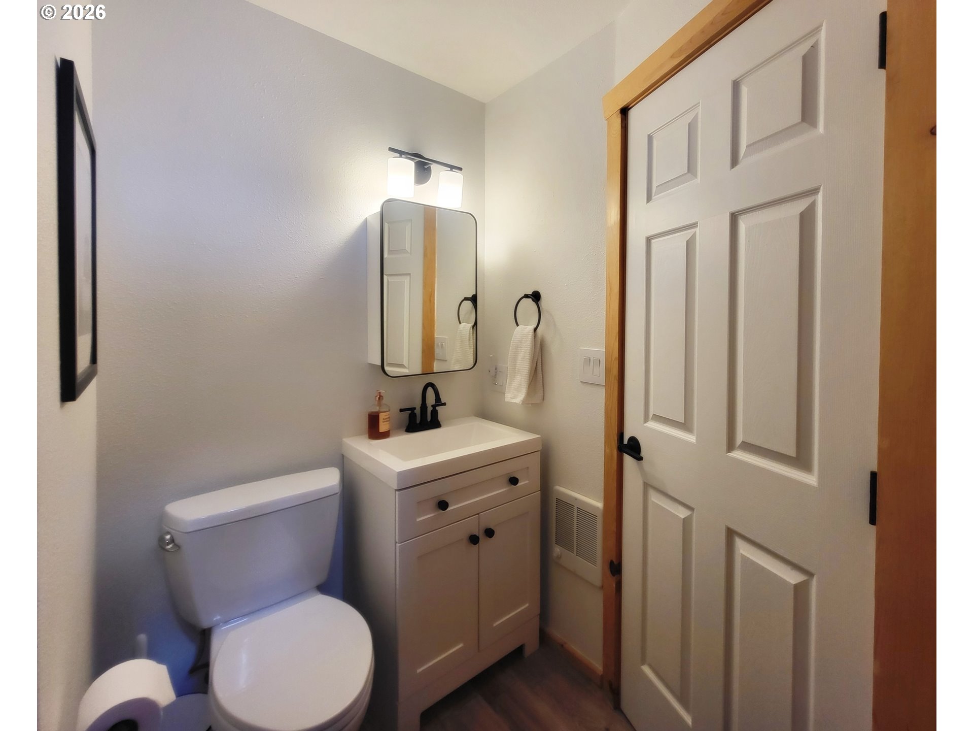 84730 Talmena Road Wallowa Lake, OR 97846 - Photo 25 of 25 a bathroom with a toilet a sink and mirror