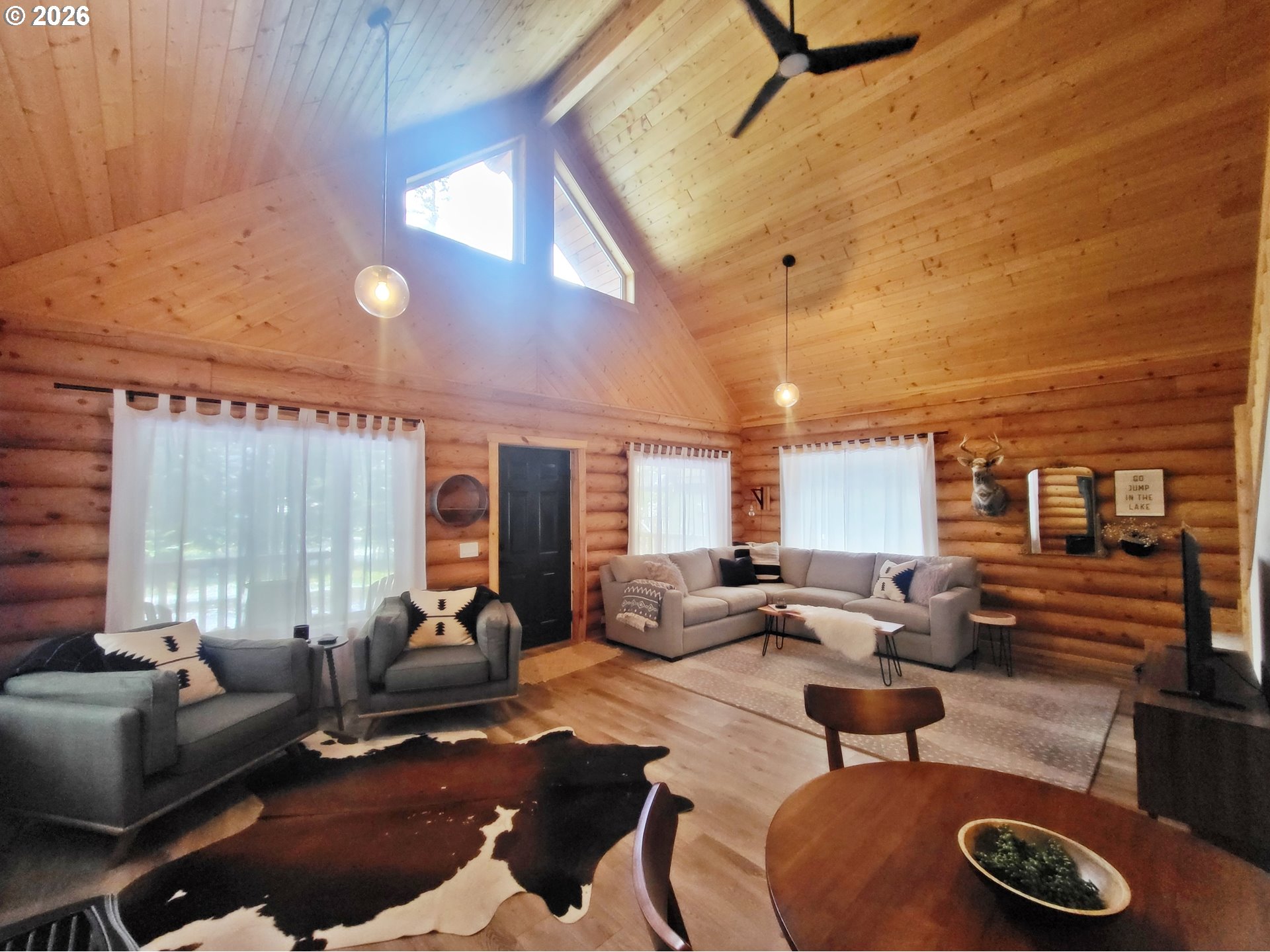 84730 Talmena Road Wallowa Lake, OR 97846 - Photo 10 of 25 a living room with furniture and a large window