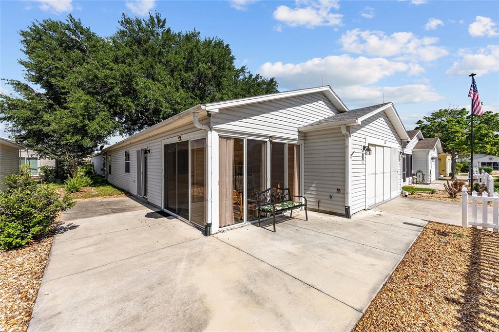 1710 Rosales Road The Villages, FL 32162 - Photo 2 of 23 a view of a house with backyard and sitting area