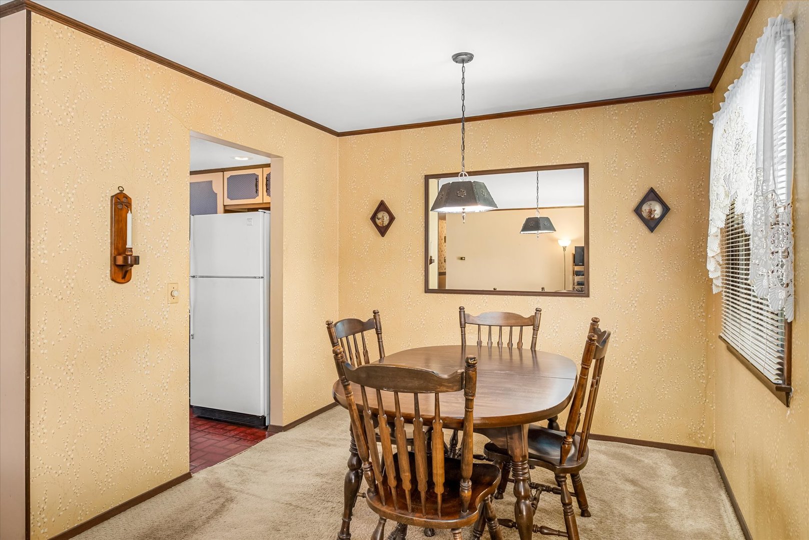 33 Somerset Road Montgomery, IL 60538 - Photo 8 of 17 a view of a dining room with furniture and a window