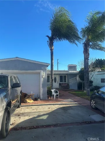a view of a patio with a table chairs and a fire pit