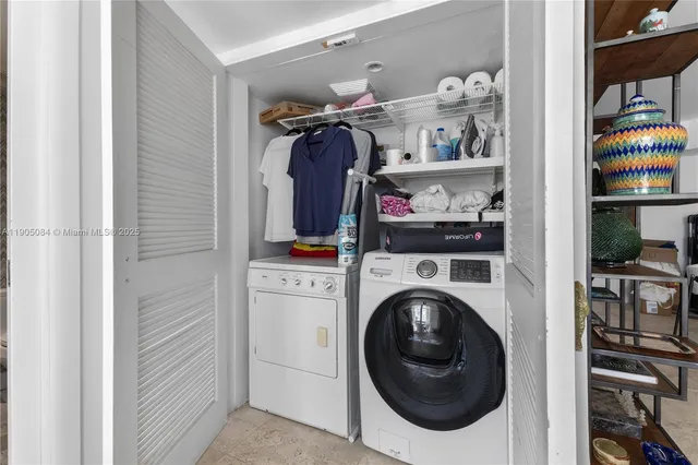 a utility room with dryer and washer
