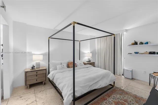 a bedroom with a bed and a mirror