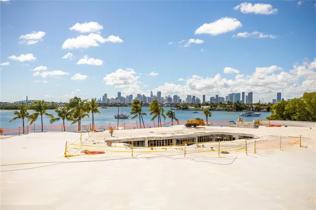 a view of a swimming pool with a lawn chairs