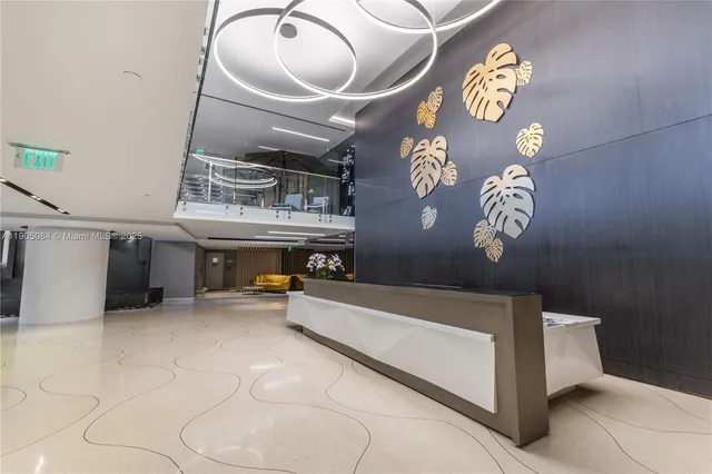 a living room with a table and chairs