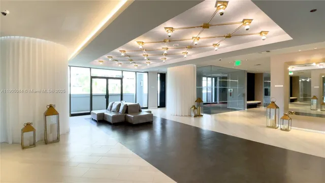 a lobby with furniture and a large window