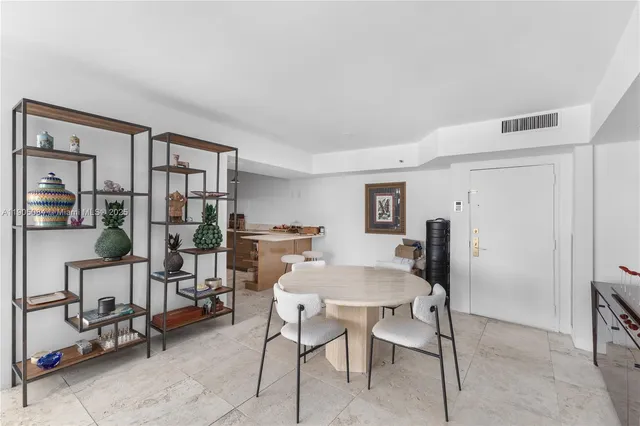 a view of a livingroom with furniture and a window
