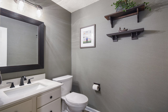 1750 Star Light Circle Cedar Park, TX 78613 - Photo 27 of 40 a bathroom with a toilet a sink and mirror