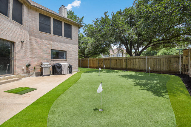 1750 Star Light Circle Cedar Park, TX 78613 - Photo 32 of 40 a backyard of a house with table and chairs