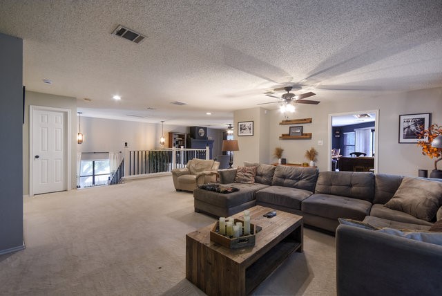 1750 Star Light Circle Cedar Park, TX 78613 - Photo 5 of 40 a living room with furniture a ceiling fan and a rug
