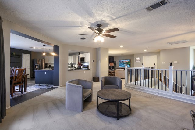 1750 Star Light Circle Cedar Park, TX 78613 - Photo 7 of 40 a living room with furniture and a ceiling fan