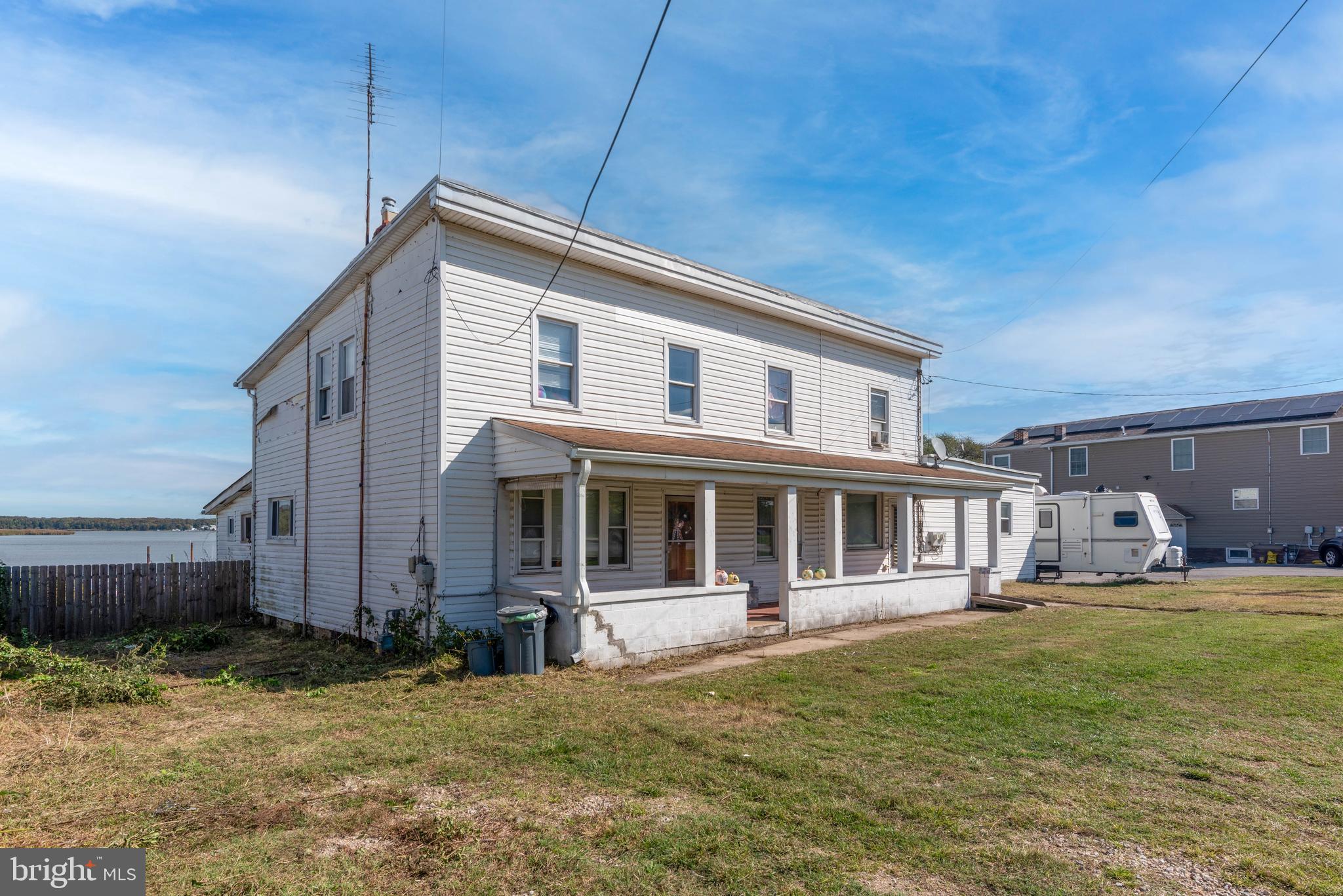 a backyard of a house with yard and outdoor seating