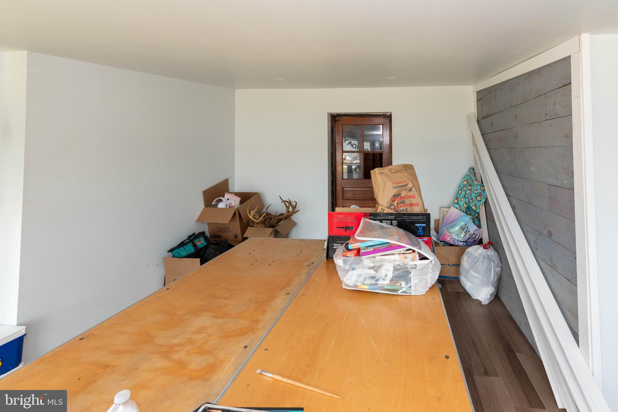 6510 North Point Road Edgemere, MD 21219 - Photo 12 of 56 a bedroom with a bed and wooden floor