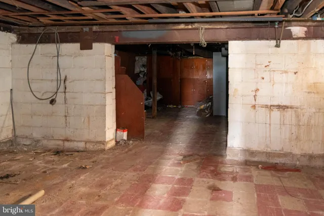 a view of a room with wooden walls