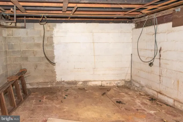 a bathroom with a shower and a sink