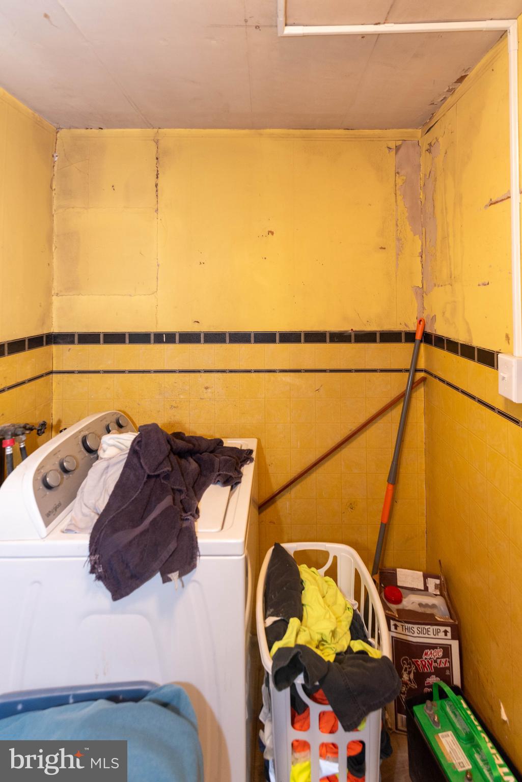 6510 North Point Road Edgemere, MD 21219 - Photo 38 of 56 a view of walk in closet with clothes and shoes