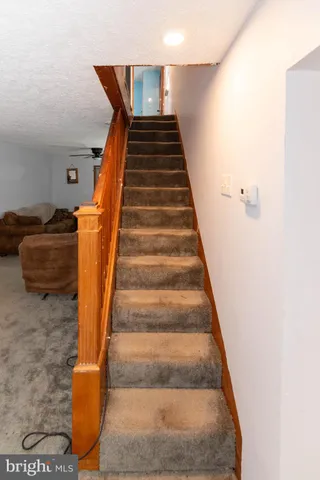 a bed room with a bed and mirror