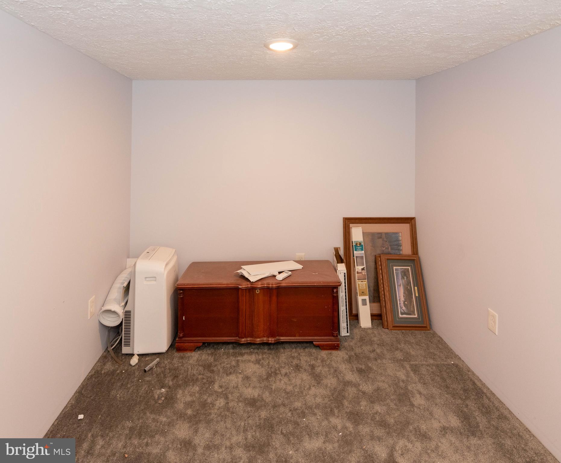 6510 North Point Road Edgemere, MD 21219 - Photo 40 of 56 a room with a bed and a table