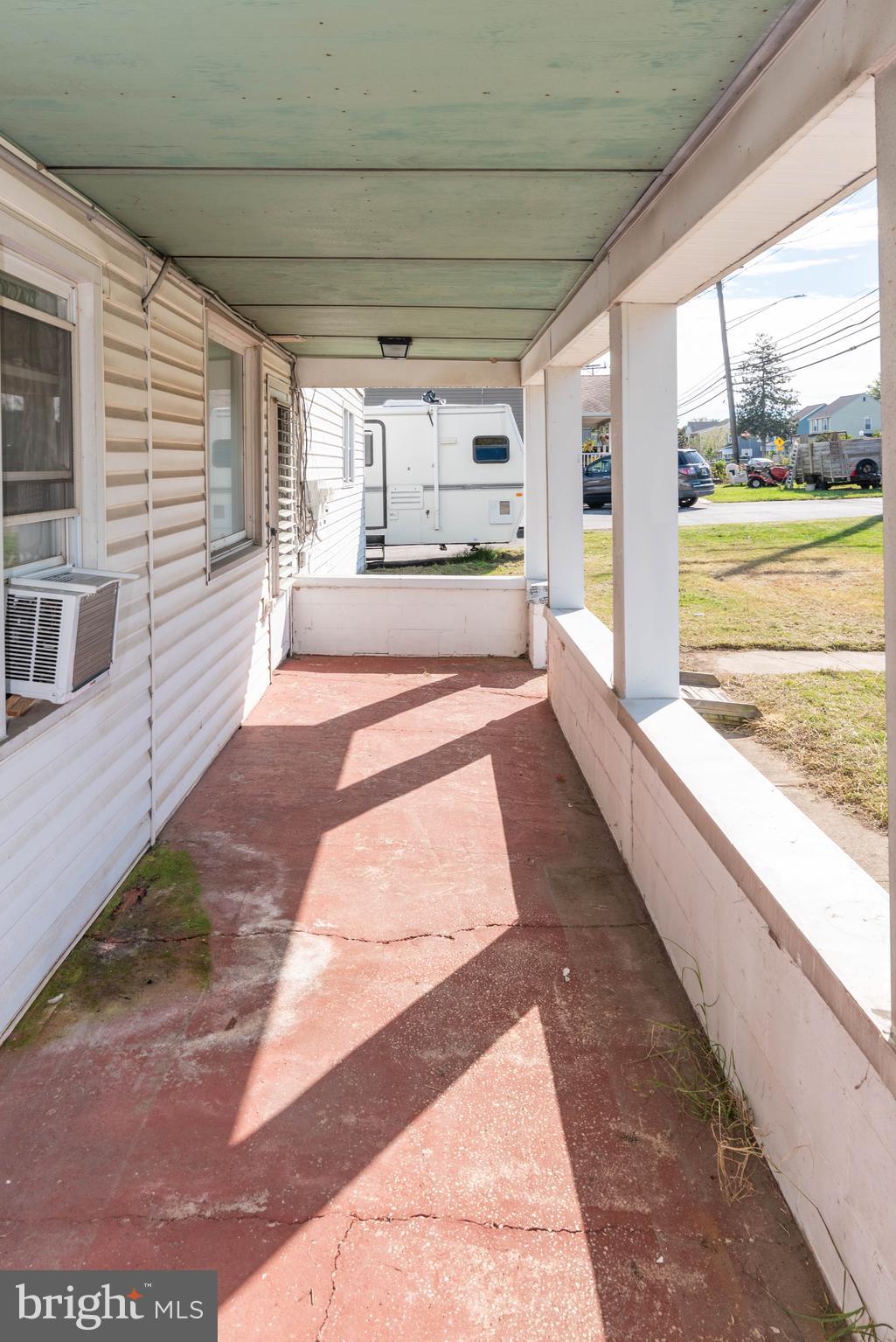 6510 North Point Road Edgemere, MD 21219 - Photo 4 of 56 a view of a large room with wooden floor and windows