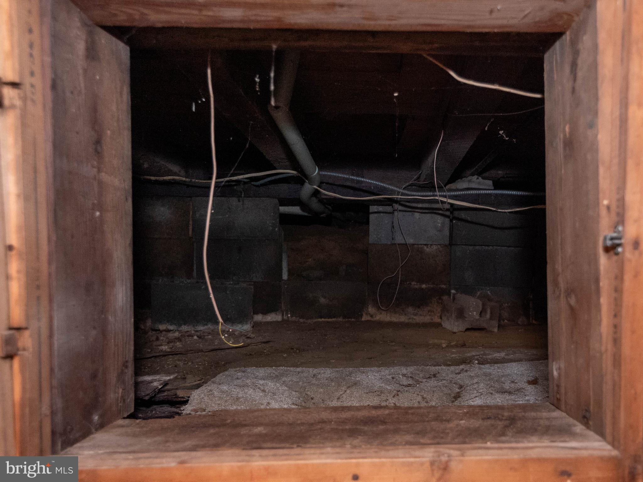 6510 North Point Road Edgemere, MD 21219 - Photo 55 of 56 a room with water heater and a wooden floor