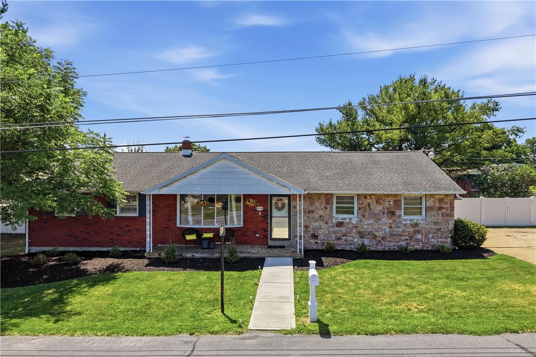 2918 Keystone Street Bethlehem, PA 18020 - Photo 2 of 54 A welcoming stone and brick exterior offers charming curb appeal with a verdant lawn.