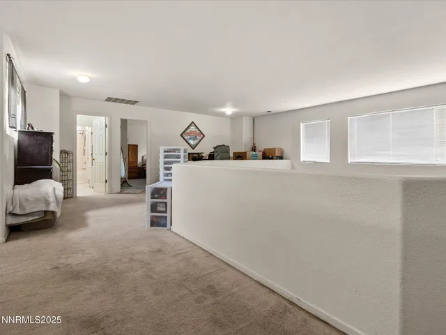a room with furniture and white walls