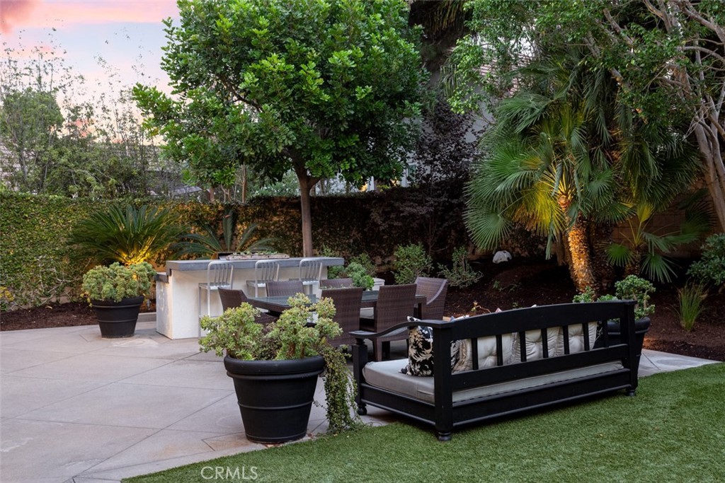 8 Madison Newport Beach, CA 92660 - Photo 15 of 34 a view of a wooden bench sitting in backyard