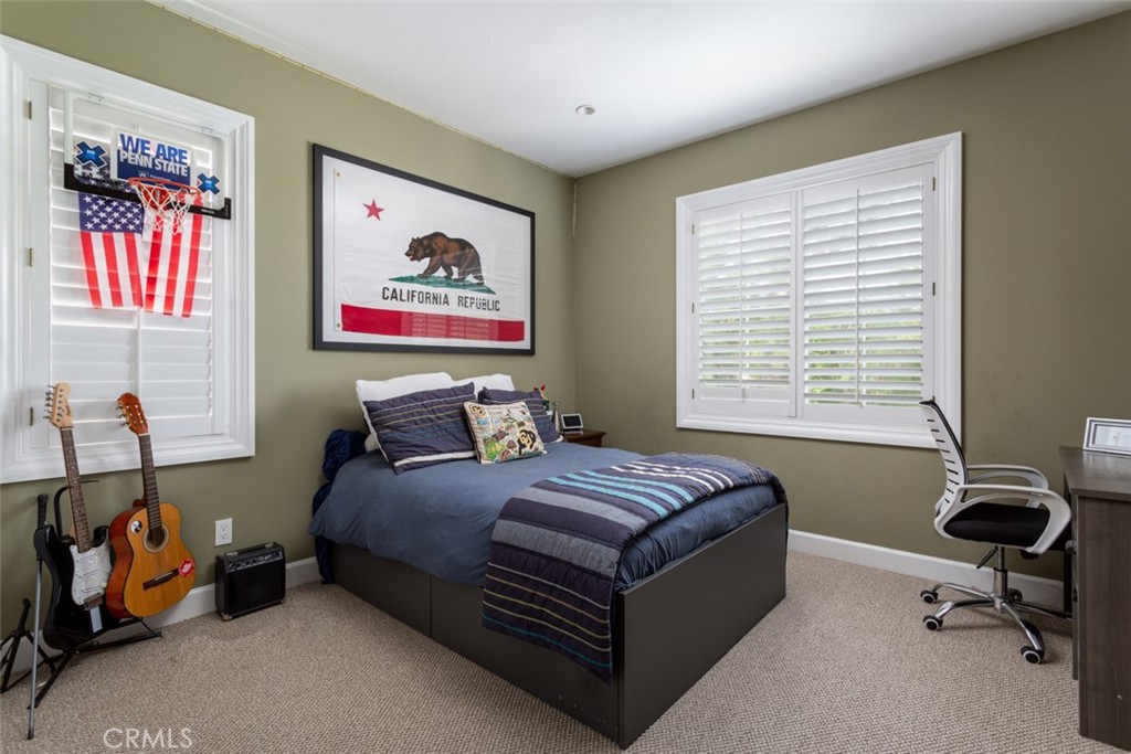 8 Madison Newport Beach, CA 92660 - Photo 23 of 34 a bedroom with a bed and a window