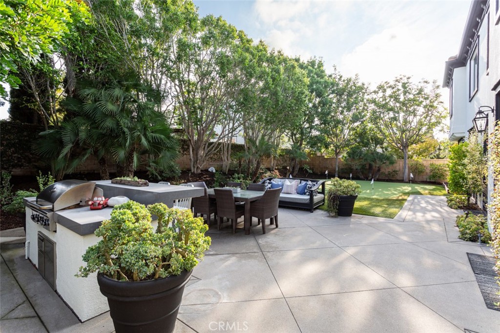8 Madison Newport Beach, CA 92660 - Photo 30 of 34 a view of a patio with couches and potted plants