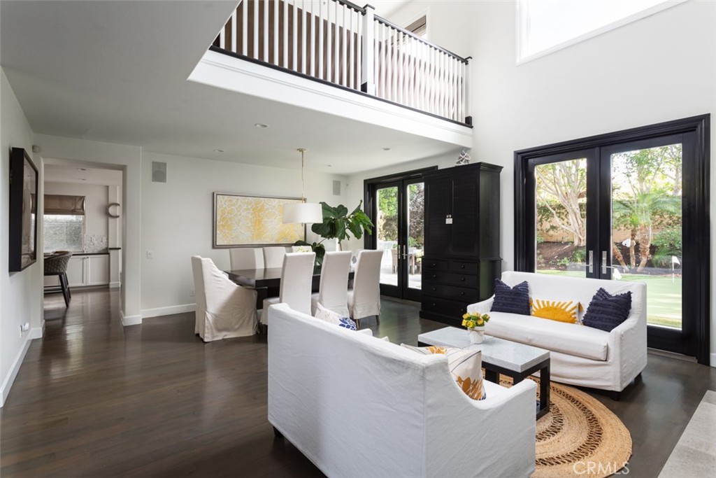 8 Madison Newport Beach, CA 92660 - Photo 3 of 34 a living room with furniture and a large window