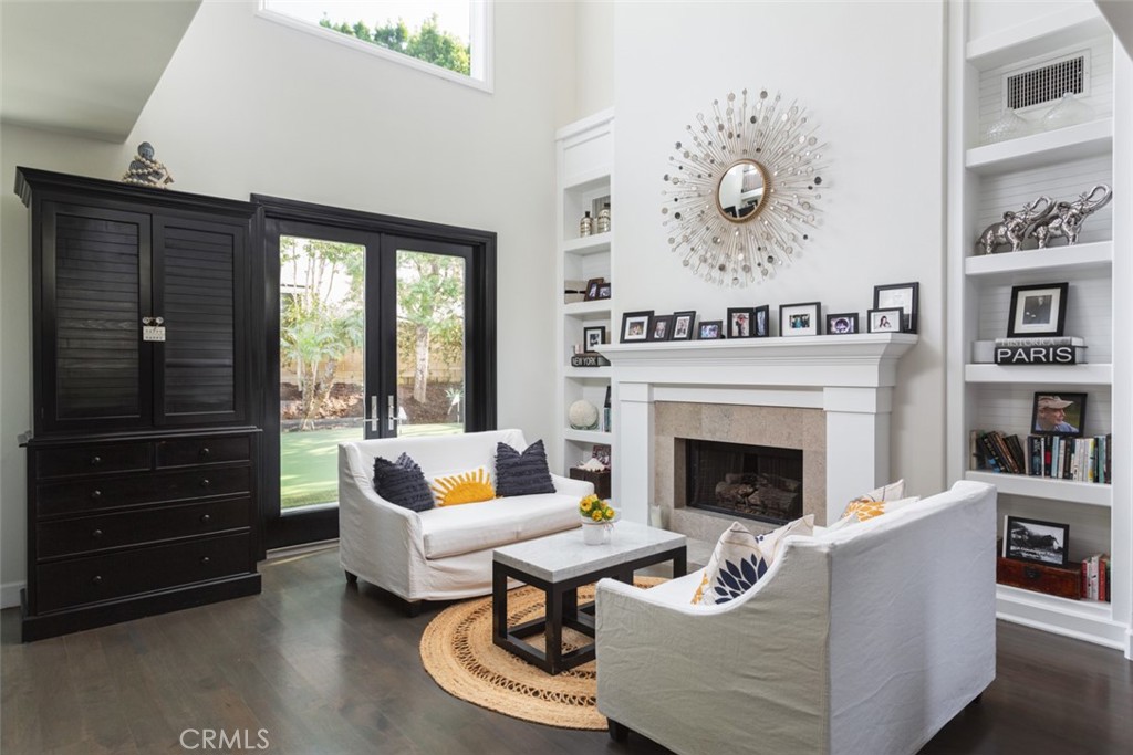 8 Madison Newport Beach, CA 92660 - Photo 4 of 34 a living room with furniture and a fireplace