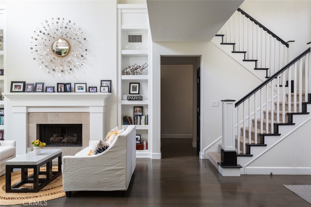 8 Madison Newport Beach, CA 92660 - Photo 5 of 34 a living room with furniture and a fireplace